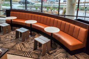 Orange curved custom banquette booth