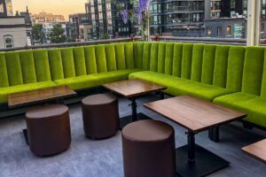 green corner banquette seating nook on roof
