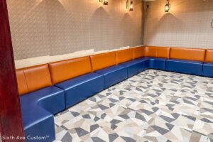 orange and blue Custom banquette seating along wall