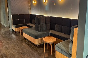 green velvet modern custom banquette seating in restaurant
