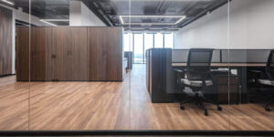 open office space featuring wooden accents and modern commercial millwork design furniture
